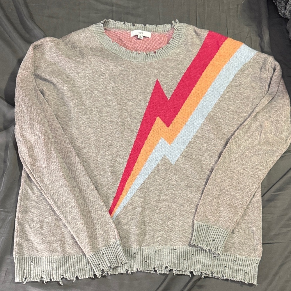 Distressed Crew Neck Sweater with Lightening Bolt Design